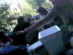 old handy-vid of a topless hippie-girl in a crowd